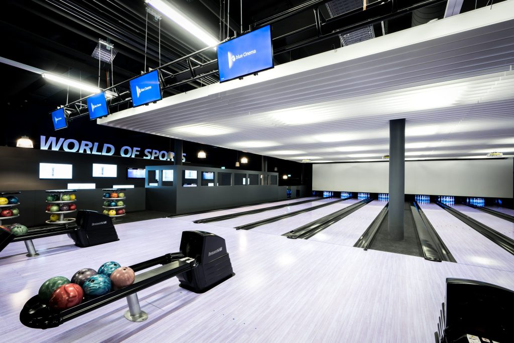 Panoramic view of the bowling lanes and lounge areas of blue Cinema.