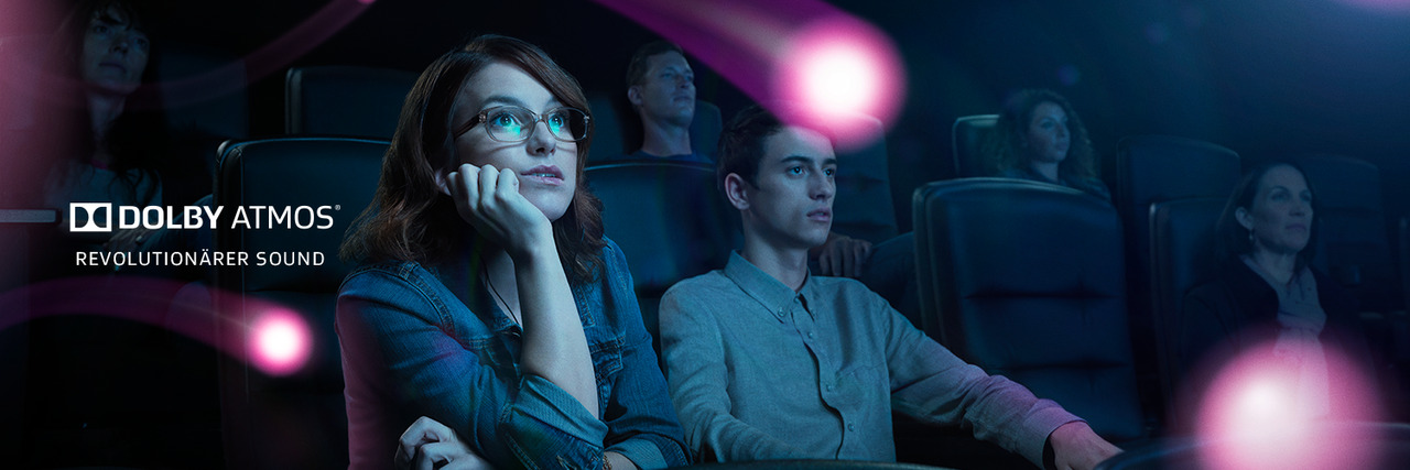 Cinema visitors experiencing impressive sound with Dolby Atmos® technology.