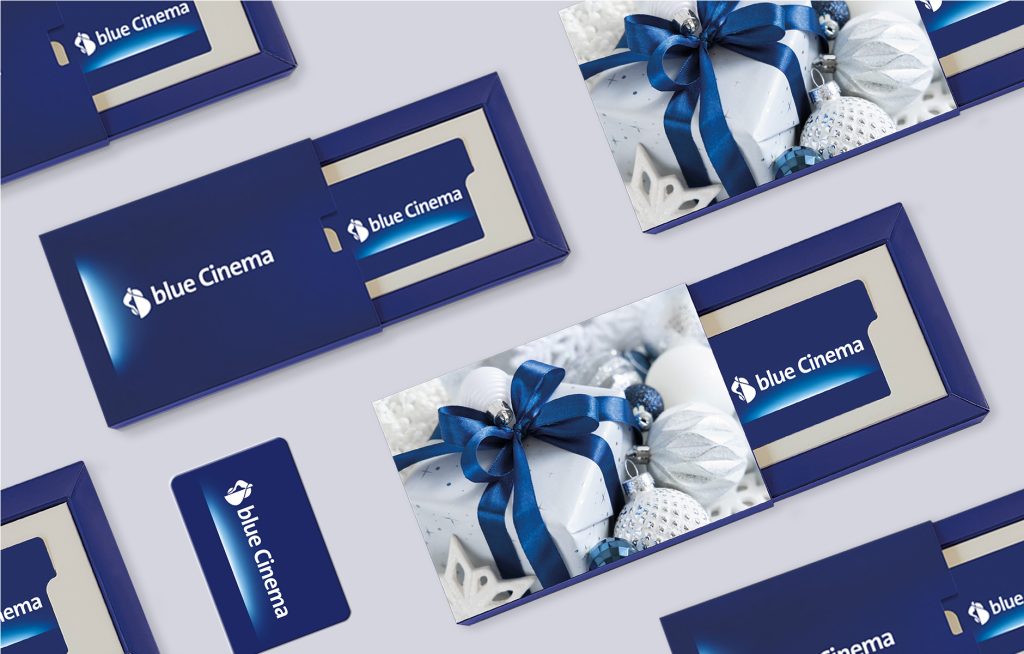 blue Cinema gift set with vouchers and Christmas-themed packaging.