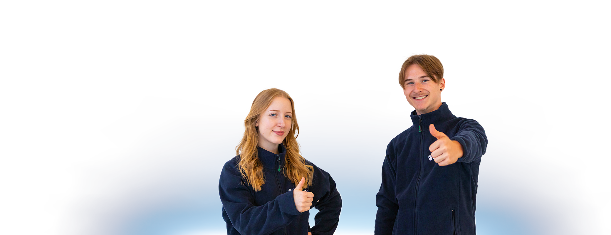 Two blue cinema employees giving a thumbs up as a sign of good service.